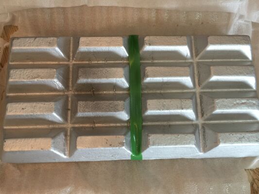 Almacenar en un lugar fresco Tipo de lingotes irregulares de aleación maestra de magnesio con superficie lisa optimizada para el procesamiento de metales y la producción de aleaciones